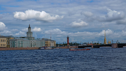 Fototapeta premium View from the river to the embankment and the bridge, ships on the water. Neva River, St. Pererburg, summer.