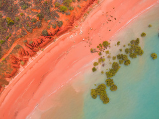 Roebuck bay in broome, western australia as seen from the air. SHowing the pink beach, red cliffs,...