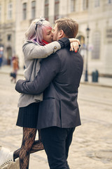 couple in love outdoor.Stunning sensual outdoor portrait of young stylish fashion couple posing in spring in city