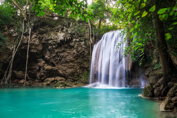 Fototapeta na wymiar Waterfall in Tropical forest at Erawan waterfall National Park, Thailand 