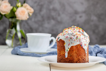 Easter cake with a cup of tea in the background