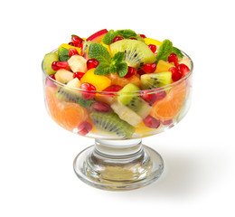 Winter fruit salad in glass salad bowls on white background. Selected focus.