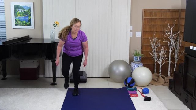 Sandra gets equipment ready to start stair stepping.
