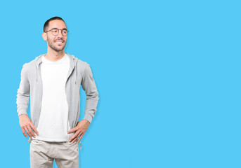 Fototapeta premium Happy young man posing against background