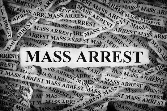 Strips Of Newspaper With The Word Mass Arrest Typed On Them