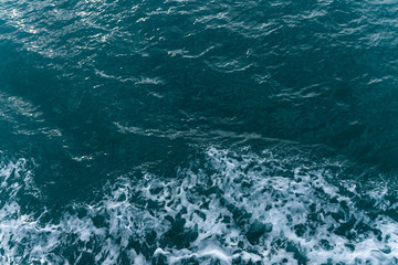 Blue water in the ocean or in the sea. Turquoise waves and Aqua Mente and Phantom Blue. Photos for wallpaper or for background. Abstraction of the waves. Thailand