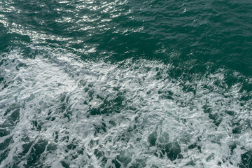 Fototapeta na wymiar Blue water in the ocean or in the sea. Turquoise waves and Aqua Mente and Phantom Blue. Photos for wallpaper or for background. Abstraction of the waves. Thailand