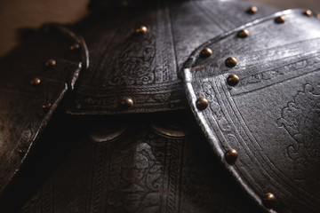 Close up detail Background with armour of the medieval knight. Metal protection of the soldier....