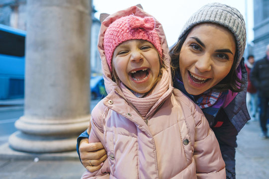 laughing mother and daughter