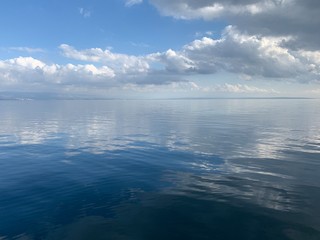Sky reflection on the surface of the sea, natural colors