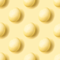 Pastel yellow eggs isometric seamless pattern. Monochrome Easter holiday concept. Modern minimal food photography collage. Top view, flat lay
