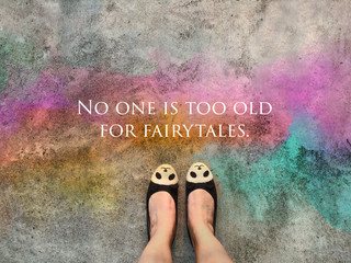 No one is too old for fairytales word and panda face shoe standing on colorful road background