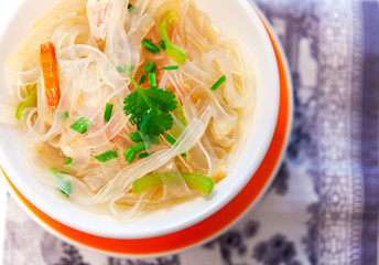 Soup with cellophane noodles, chicken and sweet green pepper.