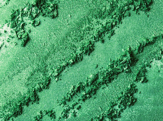 Green Eye shadow stroke isolated on white background. Top view, flat lay.