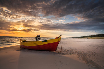 beautiful wooden fishing boats at sunset on the Baltic Sea