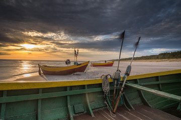 beautiful wooden fishing boats at sunset on the Baltic Sea