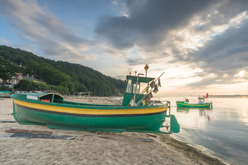 beautiful wooden fishing boats at sunset on the Baltic Sea