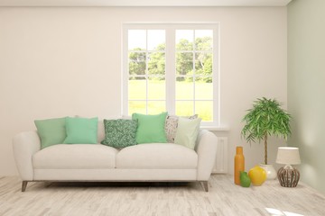 Stylish room in white color with sofa and summer landscape in window. Scandinavian interior design. 3D illustration