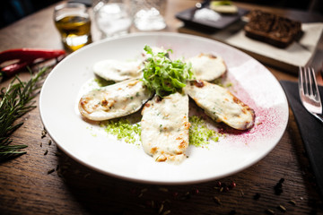 Cooked green mussels with parmegano and cream cheese