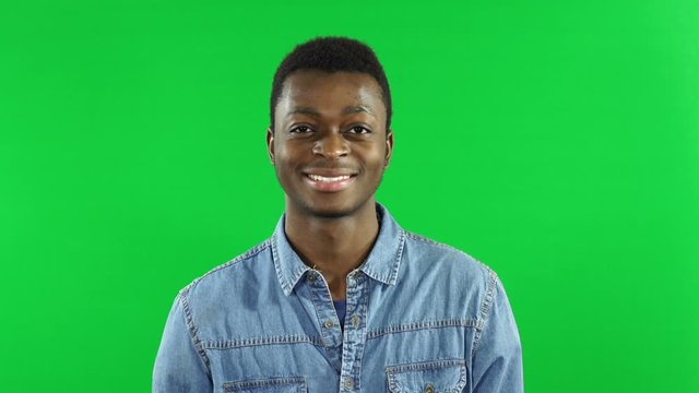 Portraits of Diverse & Multi-Cultural Young People smiling and  Looking at Camera with Green Screen Chroma Key Background - Stock Video Clip Footage