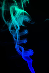 Obraz premium Colored smoke on black background