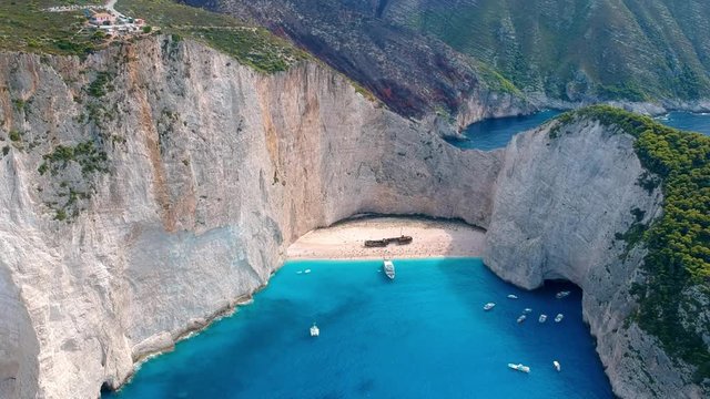 Pullback aerial drone shot of the famous hidden beach at Zakynthos