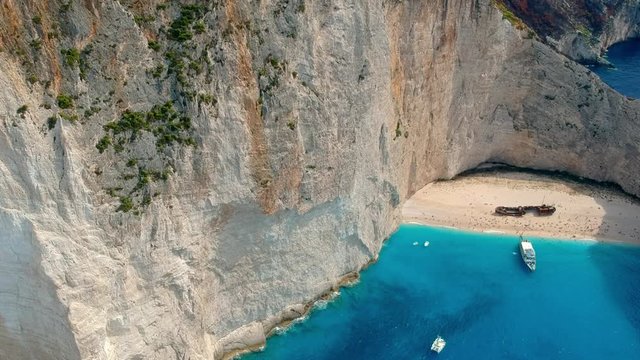 Aerial shot of a small hidden beach in Zakynthos and a small village