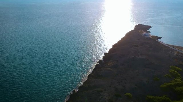 Aerial shot of sea surface reflects bright sunlight at Zakynthos