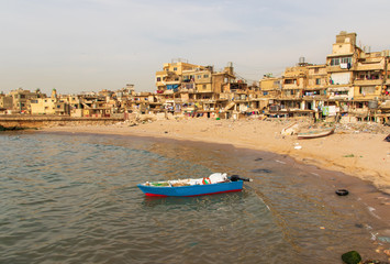 Fototapeta premium Beirut, Lebanon - once a popular bathing spot, the Saint Simon beach today is a pretty messy district with rundown buildings and trash all over. Still it can dispay beautiful views