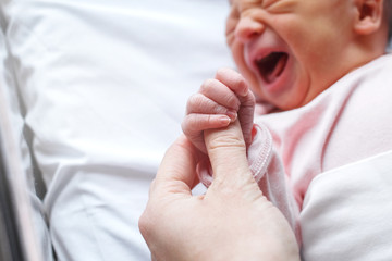A newborn cries in a dream. The child in the hospital is in boxing. Children Protection Day