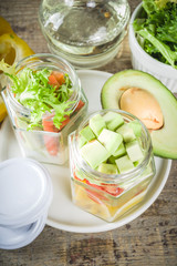 Healthy take-away lunch jar. Vegan vegetable salad in glass jars, with sliced fresh vegetables. Detox, raw eating and zero waste lunch concept
