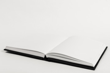 An open book on a table.