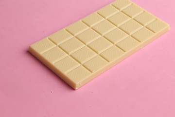 white chocolate tablet in color background