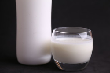 liquid yogurt bottle in color background