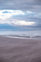 Fototapeta na wymiar Vacant Empty Beach During Winter Storm