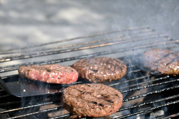 cooking burgers in nature on fire
