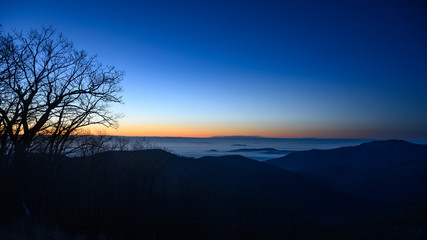 Fototapeta na wymiar Jupiter and Fog Covered Virginia Piedmont Before a Winter Dawn