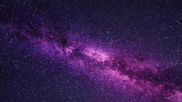Time lapse of the moving Milky Way in the night sky. Flying into the colorful and vivid galaxy. A flight through the Universe.