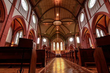 Fototapeta na wymiar Netherlands, Goes. August 2019. The interior of the church Father Damian parish.