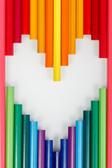 Obraz premium Multicolored pencils in the form of a heart