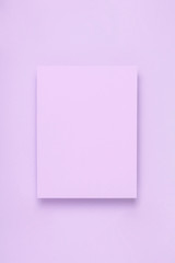 Minimal frame mock up. Blank sheet of lilac paper postcard on delicate lilac background. Template for design