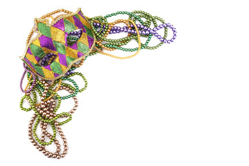 holiday or mardi gras beads and mask making frame isolated on white background © vetre