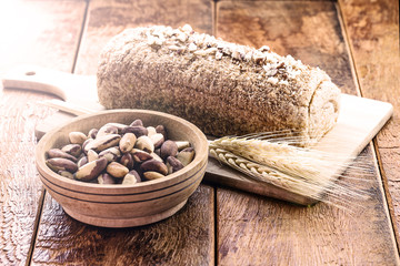 Vegan product made at home, totally organic. Bread on rustic wooden background, with Brazilian products. Brazil nut bread