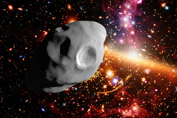 Asteroid flying in the deep space. Elements of this image furnished by NASA.