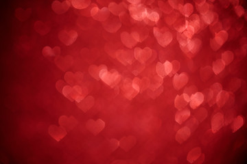 Shiny red hearts bokeh light background. Valentine day, wedding or mother day concept