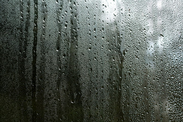 condensation droplets in a window glass, nature abstract background