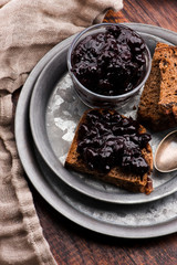 Bread with blueberry jam on the plate