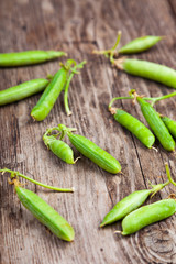 Green peas in a wooden bowl.