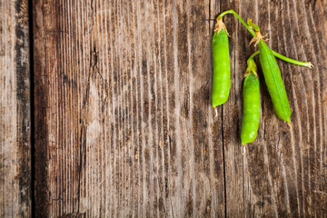 Green peas in a wooden bowl.