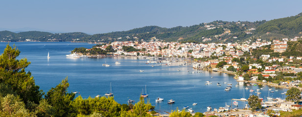 Skiathos island Greece port harbor city overview town panoramic view banner landscape Mediterranean...